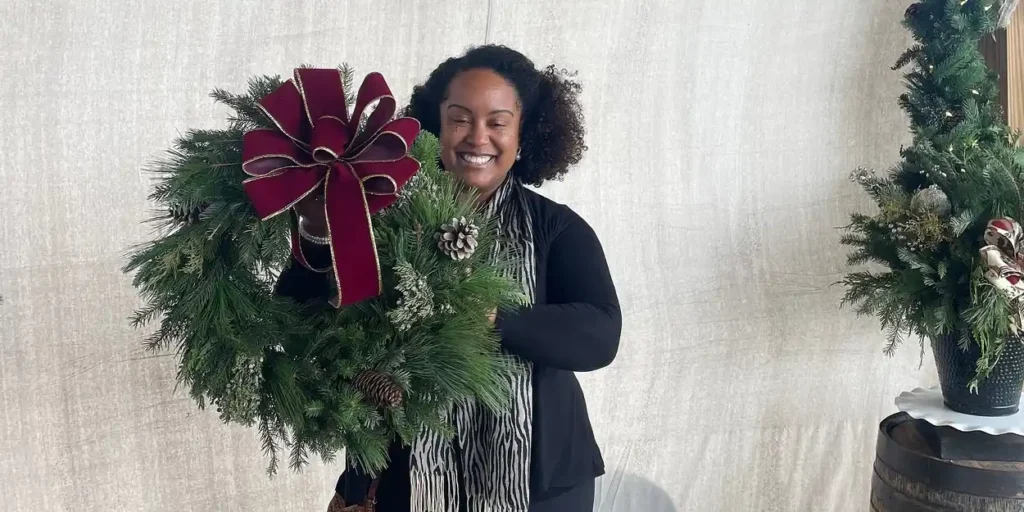 woman holding wreath
