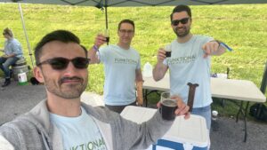 3 men holding beer