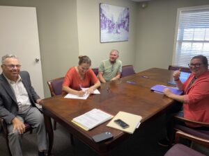 Woman signing settlement papers