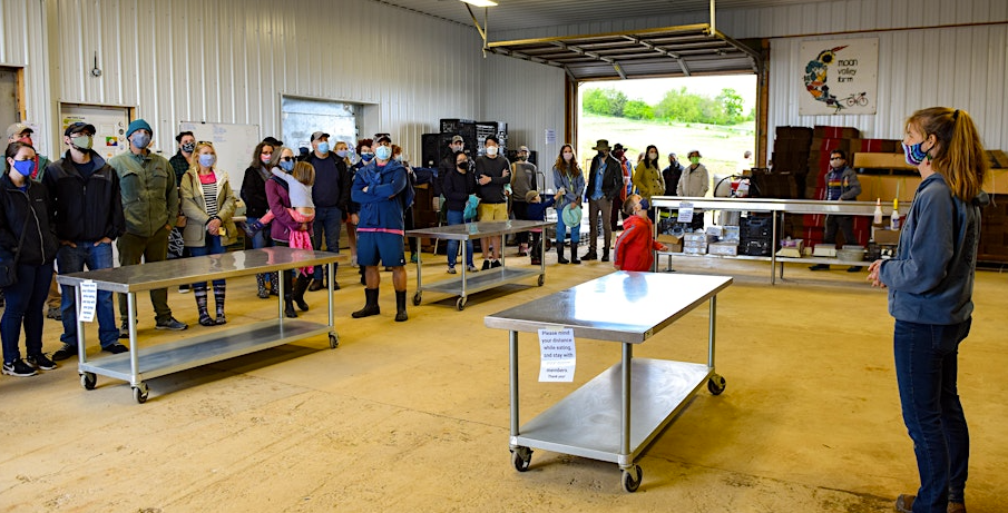 farmers in a packshed