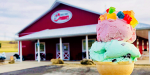 Ice cream cone in front of a red market