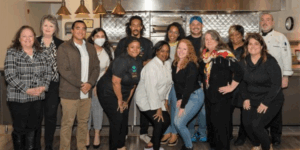 Group of diverse individuals in a kitchen
