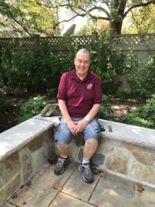 man sitting in garden