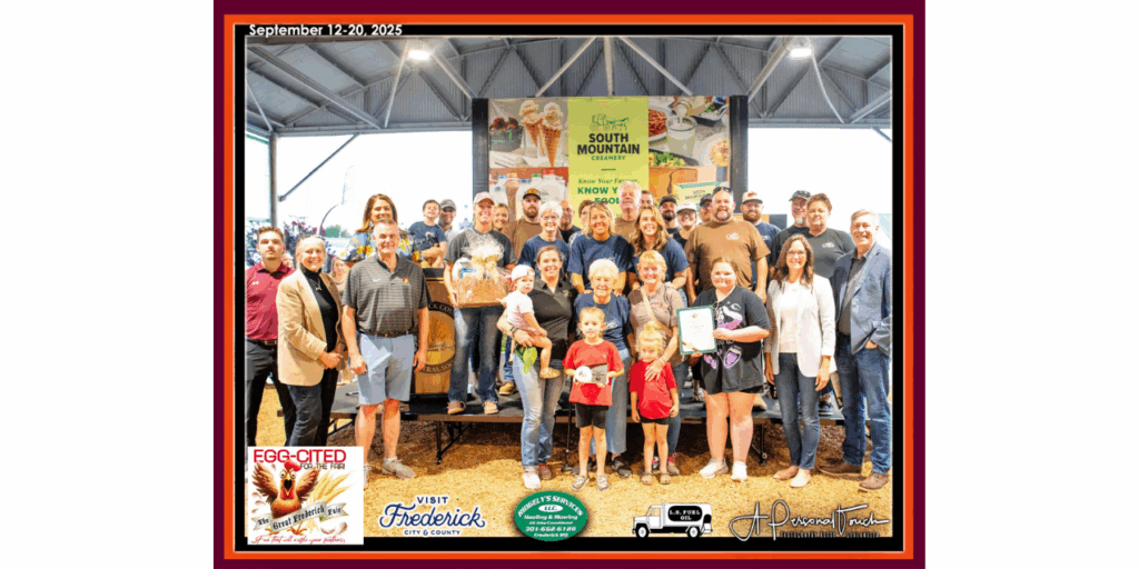 large family receiving an award on a stage