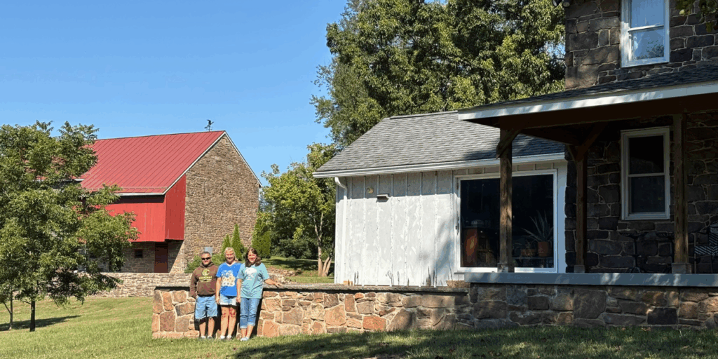 Family in front of farm property