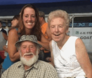 1 man and two women  smiling