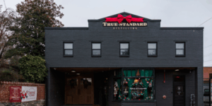 front of distillery decorated for christmas