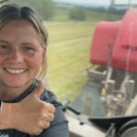 Woman farmer driving tractor