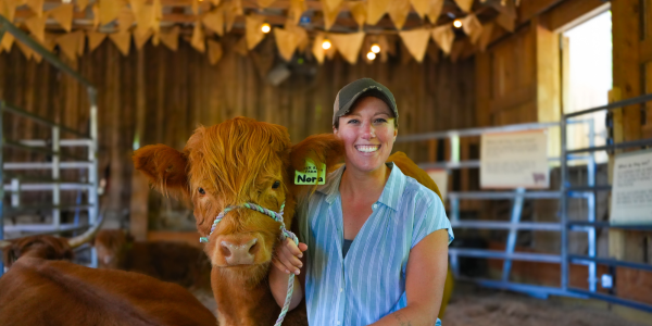 a women and her highland cow