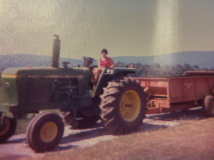 a women driving a tractor in the 1900s